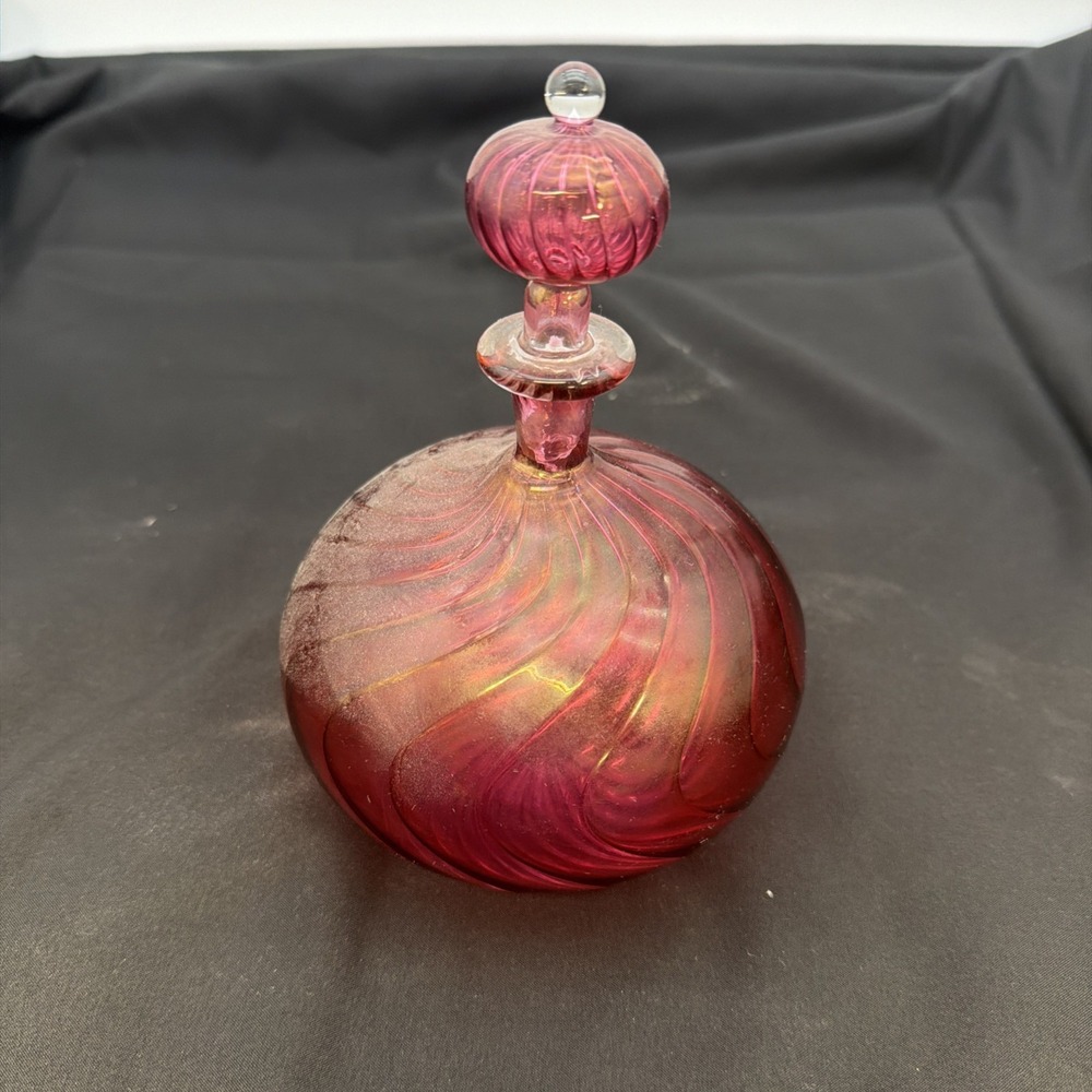 handblown art glass perfume bottle features a distinct swirled or ribbed pattern